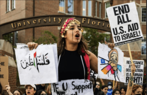 Farrah Maswadeh stands outside of the University of Florida entrance on 13th Street and West University Avenue in Gainesville, Florida, on Oct. 23, 2023. (Gabriel Velasquez Neira/WUFT News)